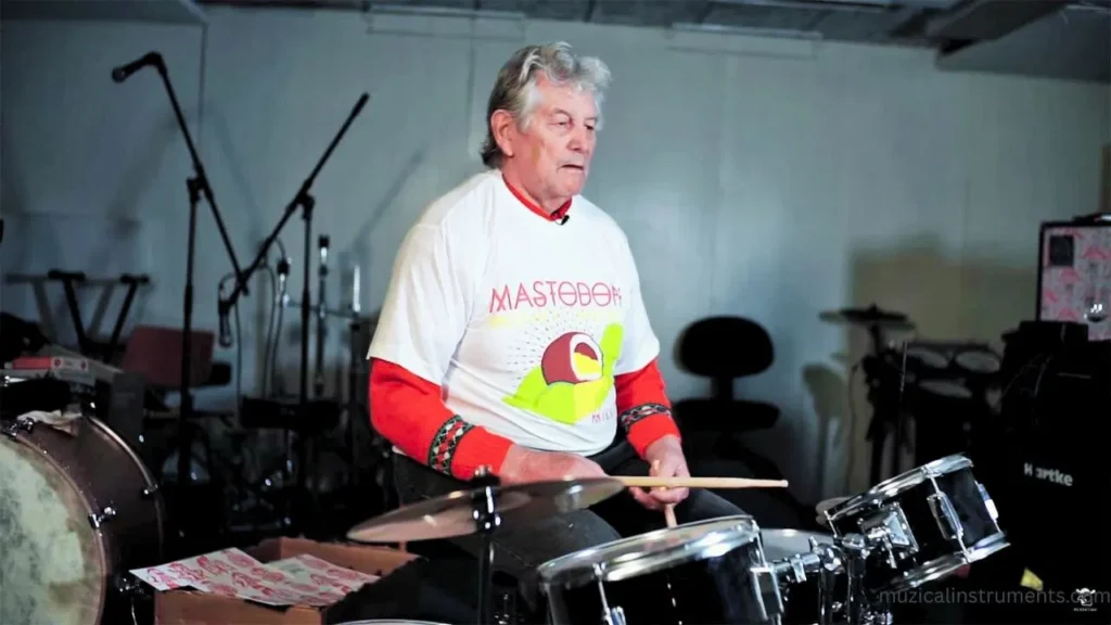 Mastodon Brann gives old man a drum lesson
